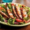 Grilled Top Sirloin Served Over a Bed of Lettuce, Tomatoes and Hearts of Palm